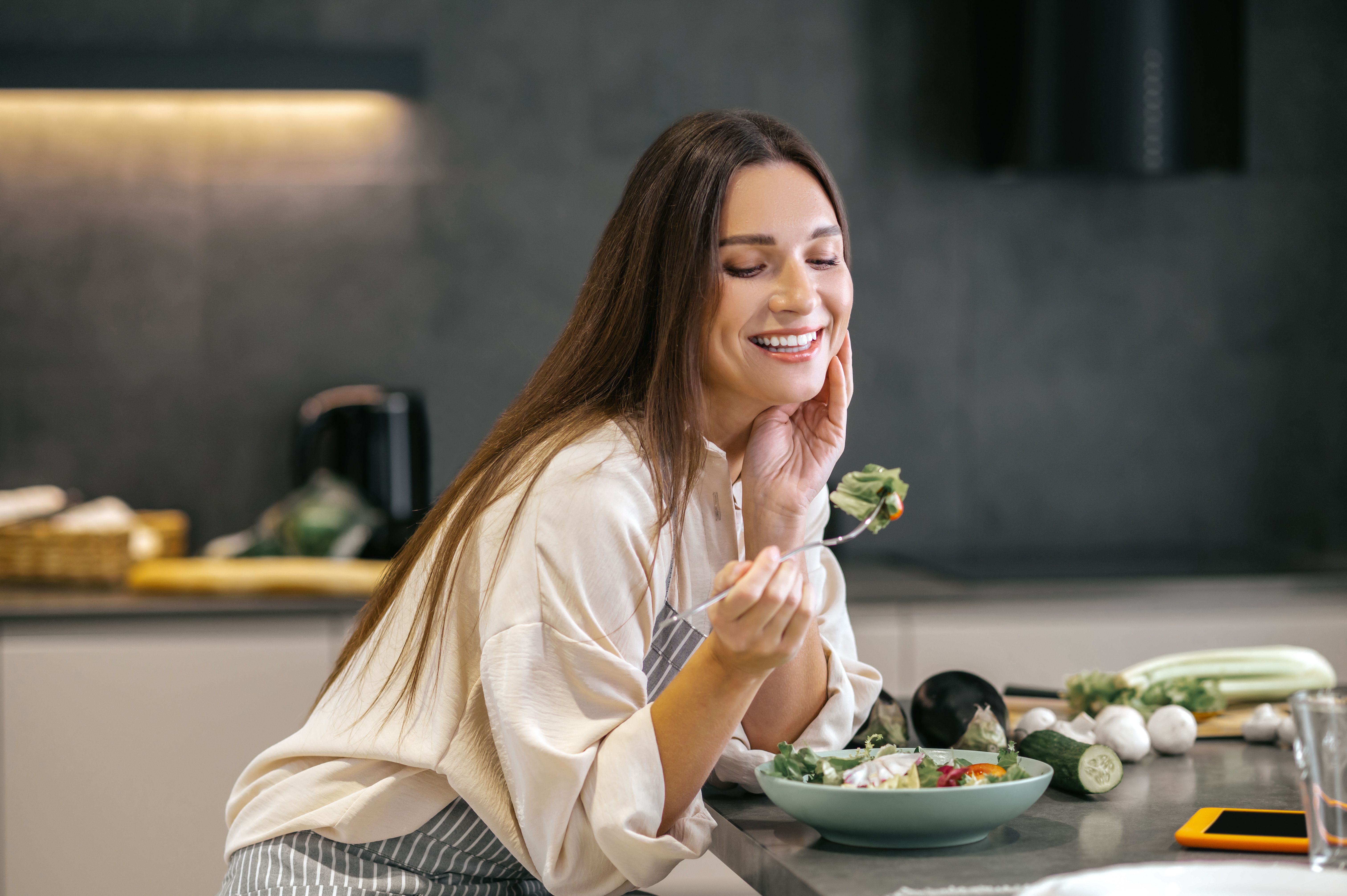 Mindful eating - Menopausal woman enjoying food 